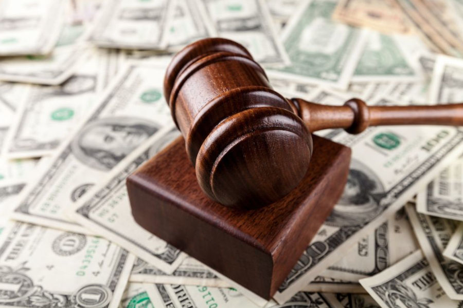 Gavel on top of money Gavel on top of money