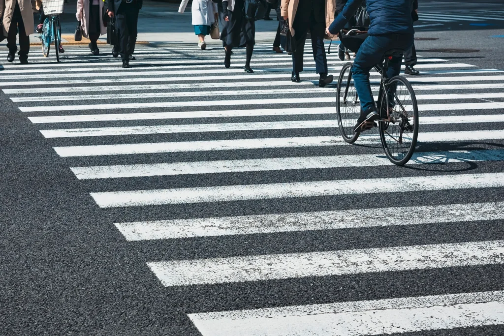 A crosswalk full of pedestrians.